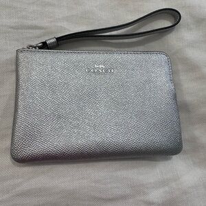 COACH - silver shiny wristlet / used 1 time.